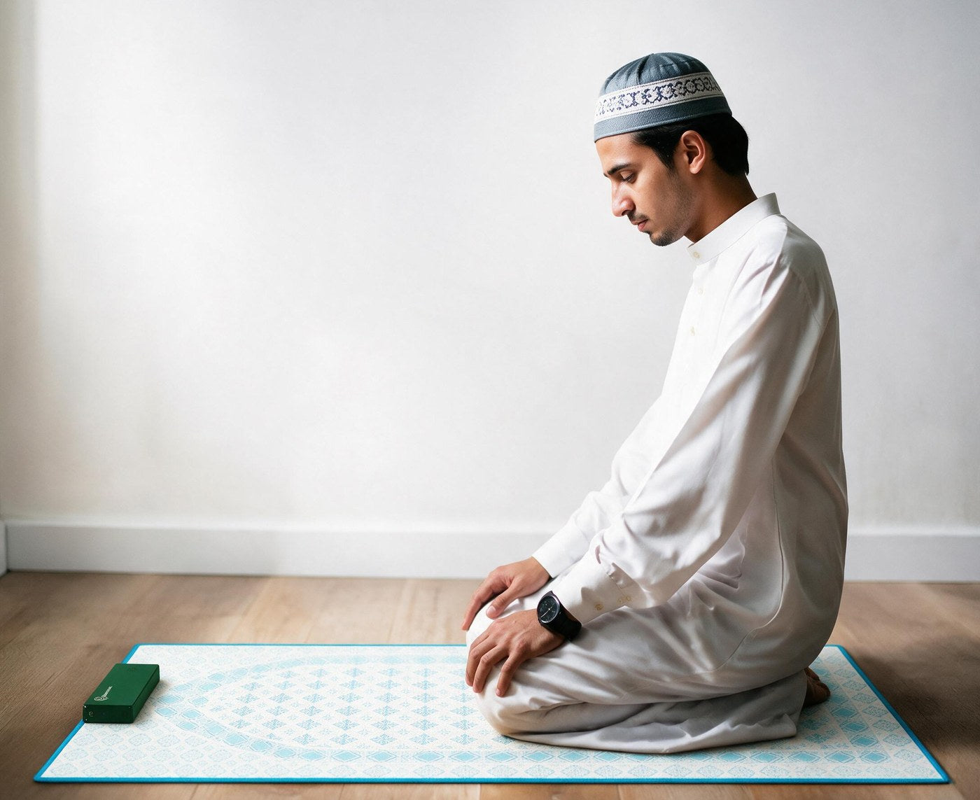 A Muslim worshipper using a NoorConnect prayer mat in a private setting